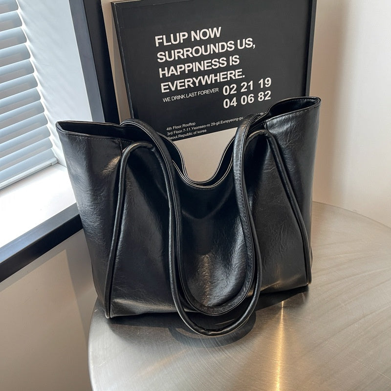 Black soft PU leather large-capacity tote bag, front view