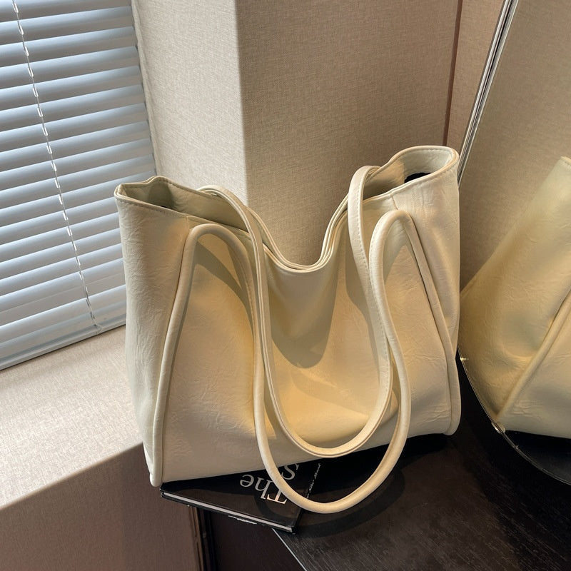 Milky white soft PU leather large-capacity tote bag, front view