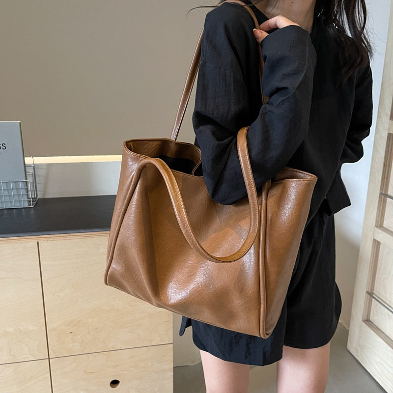 Light brown soft PU leather shoulder tote bag in use